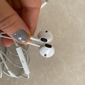 Apple IPhone headphones with cord.